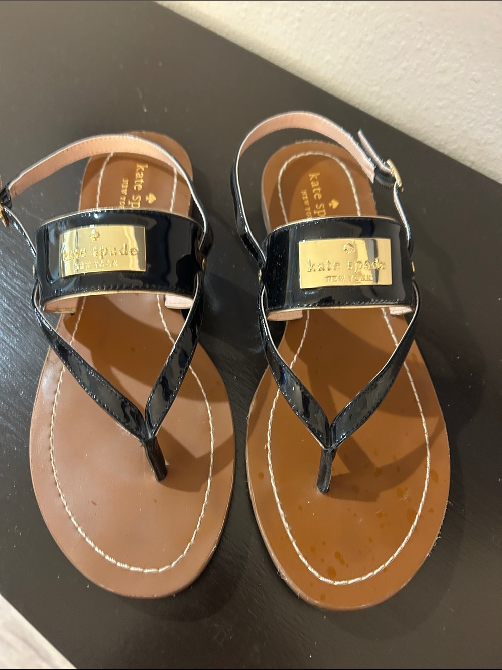 kate spade Black Patent Leather T-Strap Sandals with Gold Plaque